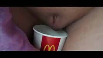 German Blonde girl pees in a milkshakecup video